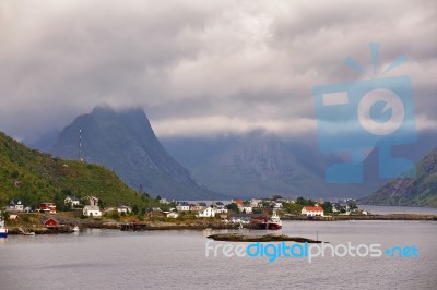 Norway Village On A Fjord. Nordic Cloudy Summer Day Stock Photo