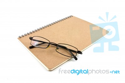 Notebook And Eyeglasses Stock Photo