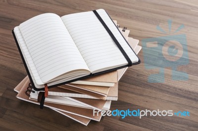 Notebook On Wood Table Background Stock Photo