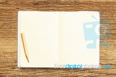 Notebook  On Wooden Table Stock Photo