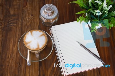 Notebook Pen And Cup Of Coffee Stock Photo