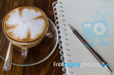 Notebook Pen And Cup Of Coffee Stock Photo