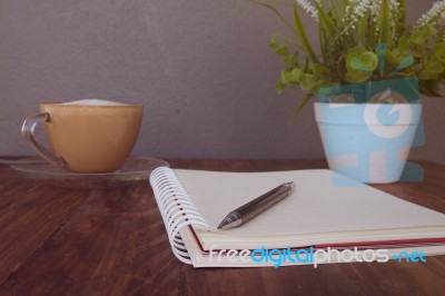 Notebook Pen And Cup Of Coffee Stock Photo