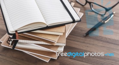 Notebook Stack On Wood Table Stock Photo