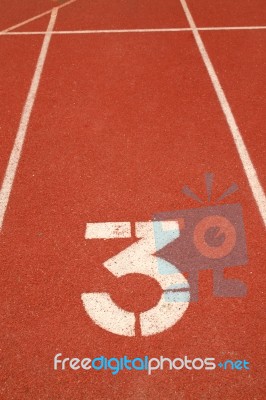 Number 3 On Running Track Stock Photo
