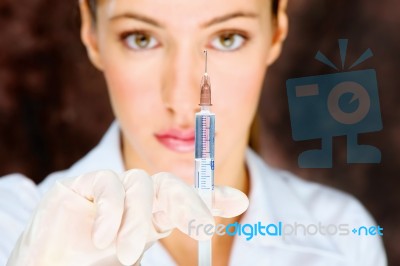 Nurse Holding Syringe Stock Photo