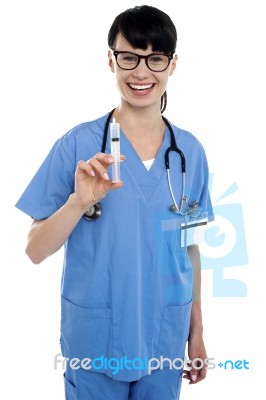 Nurse Holding Up Syringe. Ready To Be Inserted Stock Photo