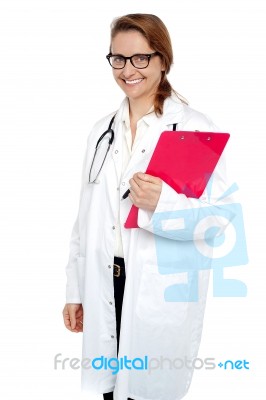 Nurse Posing With Clipboard During Hospital Duty Hours Stock Photo