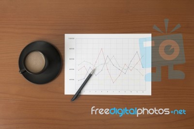 Offee On Worktable Covered With Documents Close Up Stock Photo