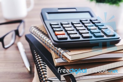 Office Desk With Calculator Stock Photo