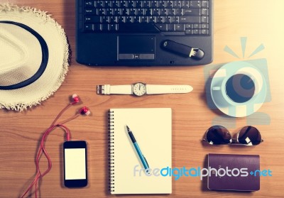 Office Desk With Computer, Supplies, Coffee Cup, Passport, Sungl… Stock Photo