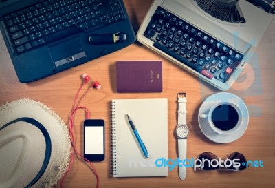 Office Desk With Computer, Supplies, Coffee Cup, Passport, Sungl… Stock Photo