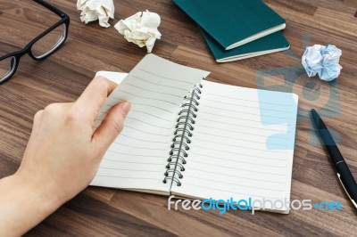 Office Desk With Hand Tearing Paper Stock Photo