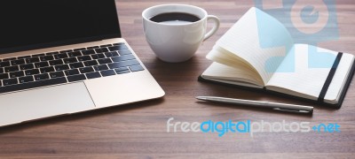 Office Desk With Laptop And Coffee Cup Stock Photo