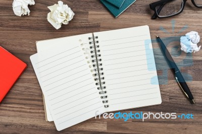 Office Desk With Notebook Stock Photo