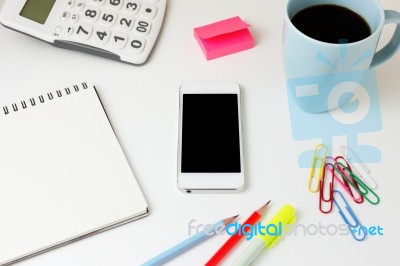 Office Desk With Smart Phone Stock Photo