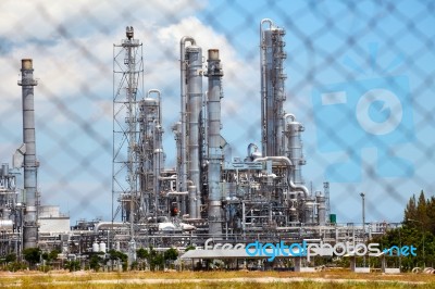 Oil And Gas Refinery Plant Behind Baluster Stock Photo