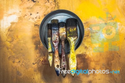 Oil Paint Brushes On Wood Painted Background Stock Photo