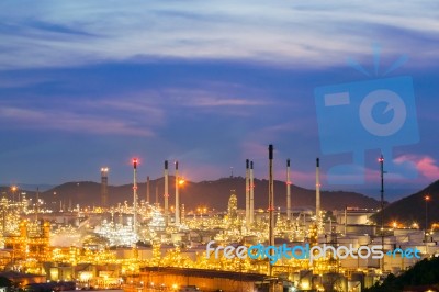 Oil Refinery Against Beautiful Sunset Stock Photo