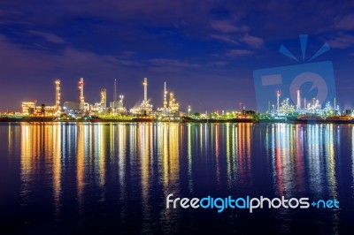 Oil Refinery At Night In Bangkok, Thailand Stock Photo