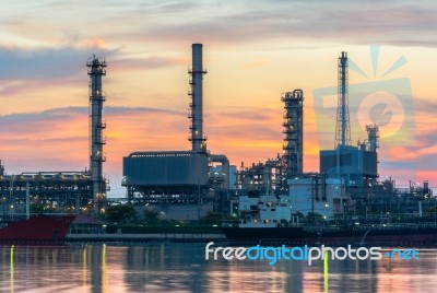 Oil Refinery At Twilight In Bangkok, Thailand Stock Photo