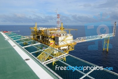 Oil Rig At Sea Stock Photo