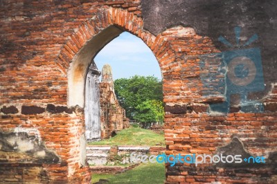 Old Ancient Pagoda In Lopburi Thailand, With Old Exterior Brick Wall Background Vintage Style Grung Texture Stock Photo