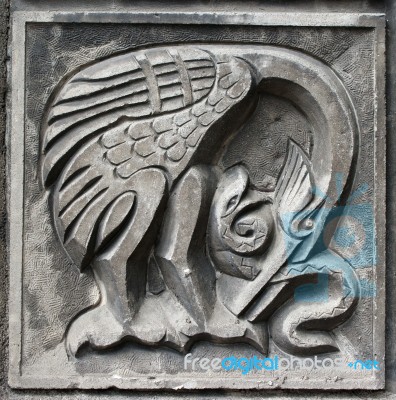 Old Bas-relief Of Fairytale Heron And Snake Stock Photo