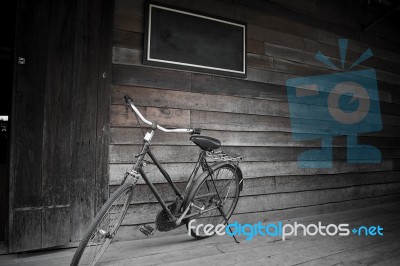 Old Bicycles And Wooden Stock Photo