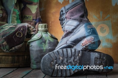 Old Boots On A Wooden Stock Photo