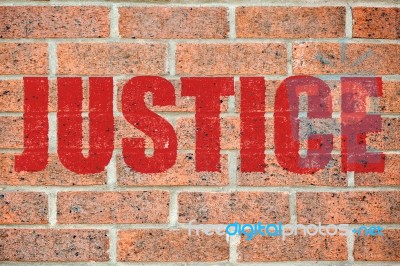 Old Brick Wall Texture With Justice Inscription Stock Photo