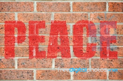 Old Brick Wall Texture With Peace Inscription Stock Photo