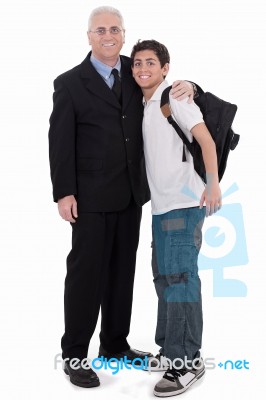 Old Business Man Embraces A Teenager Stock Photo