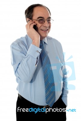 old Business Man Talking over phone Stock Photo