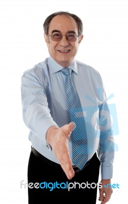 Old Businessman Offering Handshake Stock Photo