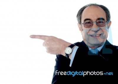 Old Businessman Pointing sideways Stock Photo