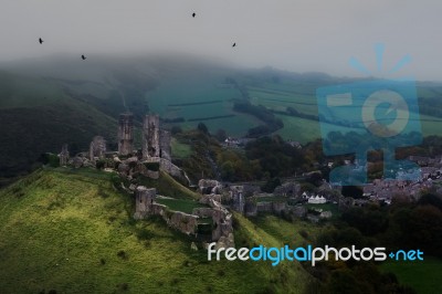 Old Castle In Ruins On Top Of Hill With Foggy Weather Stock Photo