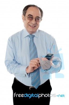 Old Corporate Man Using Cellphone Stock Photo