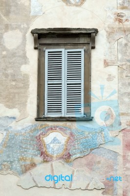 Old Faded Mural On A Wall In Citta Alta Bergamo Stock Photo