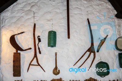 Old Farming Tools On A Wall In Budapest Stock Photo