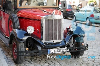 Old Fashioned Red Bus In Rothenburg Stock Photo