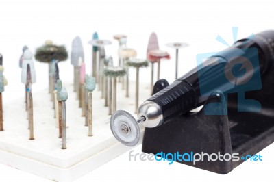 Old Grunge Micromotor Dental Lab With Set Of Dental Burs And Grinding Wheels Stock Photo