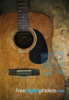 Old Guitar On Wood Textured Stock Photo