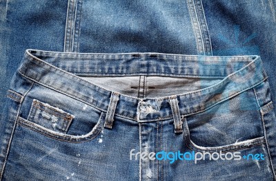 Old Jeans On The Floor Stock Photo