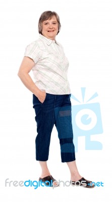 Old Lady Posing With Hand In Pocket Stock Photo