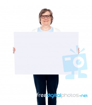 Old lady showing blank board Stock Photo