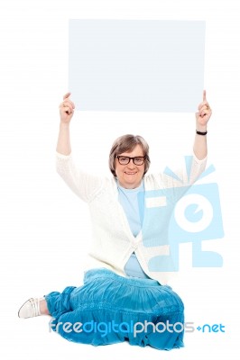 Old lady showing blank board Stock Photo