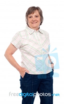 Old Lady With Hands In Pocket Stock Photo