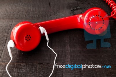 Old Landline Headphones Listening Through A Modern White Headpho… Stock Photo