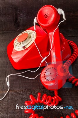 Old Landline Headphones Listening Through A Modern White Headpho… Stock Photo